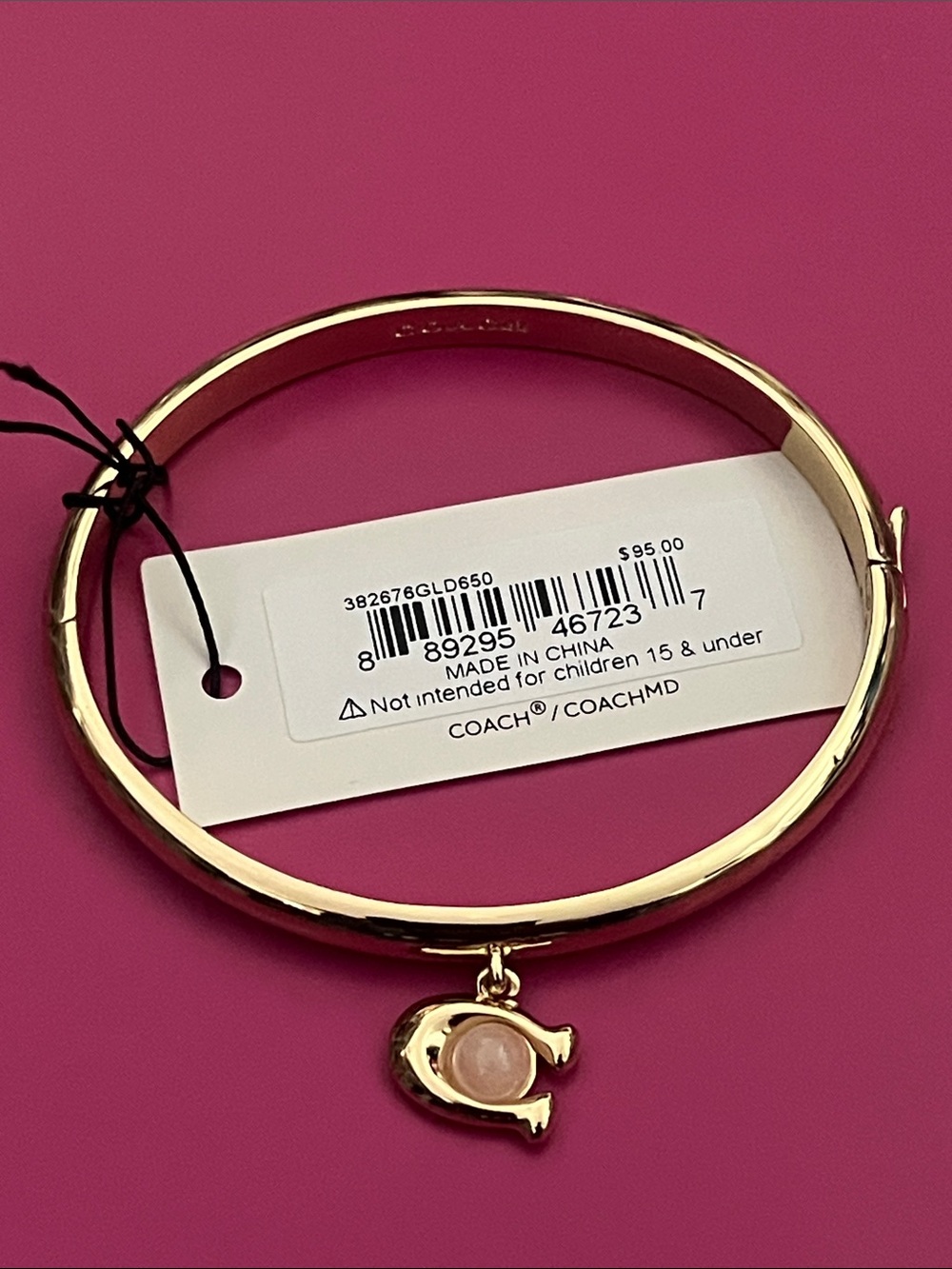 Coach Gold-Tone Bangle with Pink Stone C Charm